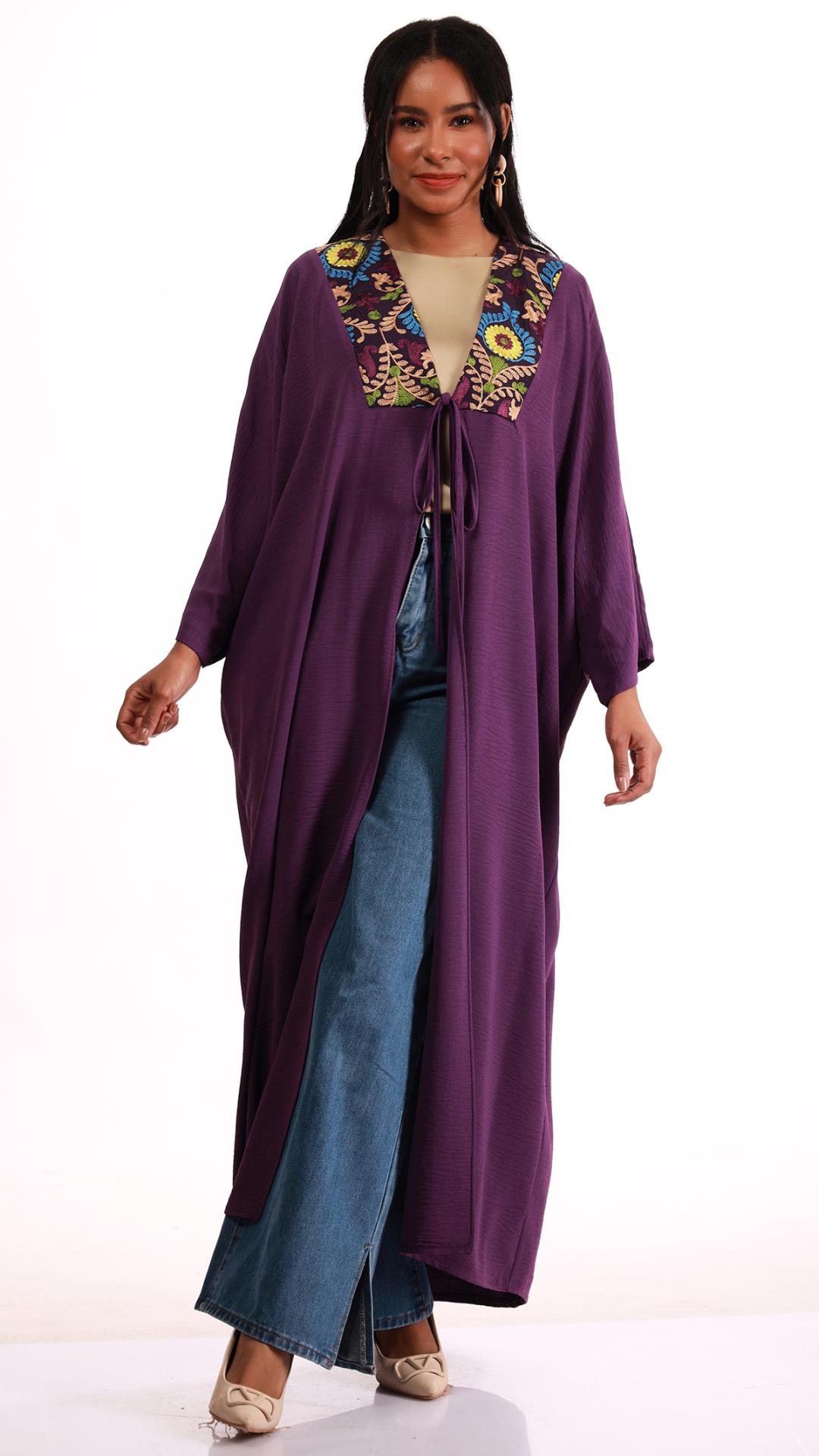 Embroidered cape at chest and back